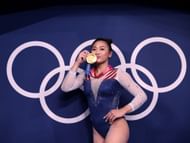 Sunisa Lee of Team United States poses with her gold medal after winning the Women's All-Around Final on day six of the Tokyo 2020 Olympic (Photo by Laurence Griffiths/Getty Images)